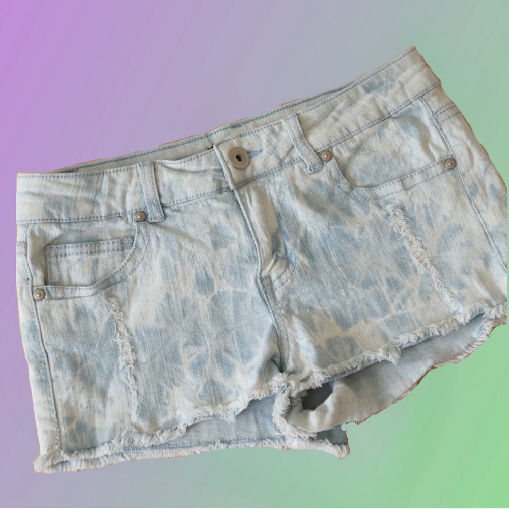 Distressed tie dye light denim shorts